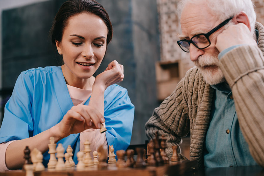 nurse and patient playing chess